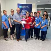 The presentation of the £2,000 donation to the Renal Unit Patient Comfort Fund.