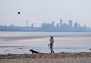 People walking dogs on New Brighton Beach on the Wirral, Merseyside on Sunday morning (Peter Byrne/PA)