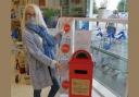 Enniskillen woman Nuala O'Toole pictured with The Kindness Postbox.