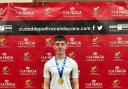 Darragh Love posing with his gold medal in Spain
