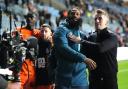 Ipswich Town manager Kieran McKenna (right) and player Janoi Donacien celebrate in front of the fans after the final whistle in the Sky Bet Championship.