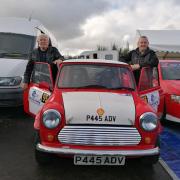 Thomas McGauran Senior and Thomas McGauran Junior in service prior to the start of the 2019 Lakeland Stages rally with the Mini the McGauran family, including son and brother Damien, built for the event.