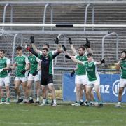 Most of the Fermanagh squad block the goal line as free-in is taken near the goals.