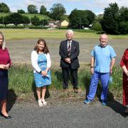 Pictured in 2021 are Arlene Foster, (right), First Minister with from left, Michelle O'Neill, deputy First Minister; Mrs Maria Nugent- Murphy, Practise Manager; Mapel Health Care; Alan Moore, WHSCB and Dr. John Porteous GP at the site of the former