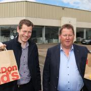 William McFarland, of Eadie, McFarland & Co., with David Mahon, Developer when it was previously announced that McDonald's were planning on moving to the old TP Topping site.