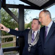 Fianna Fáil councillor, John Paul Feeley with Tánaiste, Michéal Martin looking over plans for the new discovery centre at the Shannon Pot.