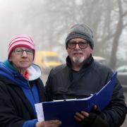 Diane McFarlane and club secretary Jim McFarlane look over the race sheets for the course.