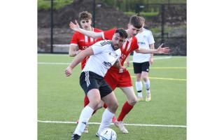 Daniel Goan holds onto possession for Enniskillen Athletic