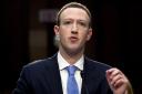 Facebook CEO Mark Zuckerberg testifies before a joint hearing of the Commerce and Judiciary Committees on Capitol Hill in Washington, Tuesday, April 10, 2018, about the use of Facebook data to target American voters in the 2016 election. (AP Photo/Andrew
