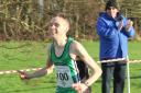 Conan McCaughey approachng the finish line during a cross country race.
