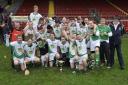 The Lisbellaw players, including a youth Ciaran Corrigan, celebrate after winning the Ulster Intermediate title in 2012.