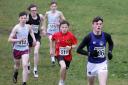 Ben Warnock, St.Kevin's, Lisnaskea on route to winning his race in The Schools Cross Country, at Necarne followed by Charlie Reihill, St. Michael's and Patrick Williams, ERGS.
