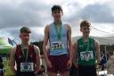 Sean Corry on top of the podium after claiming gold in the All Ireland Schools' Junior Boys Cross Country Championships.