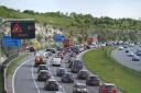 Traffic building up on the M3 southbound heading towards the coast, at Winchester, in Hampshire (PA)