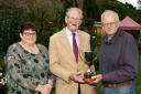 Lord Anthony Hamilton (centre), President of Fermanagh County Show, receiving The Cecil Chartres Memorial Cup from David Farrell and Mona Moore. The cup will be presented to the winner of the most first prizes in Cut Flowers and Vegetables Section of the