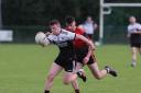 Enda McCabe keep the ball out of the reach of Dylan Bogue