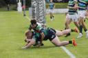 There is no stopping Aaron Crawford as he drives over the line to score for Clogher Valley