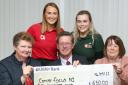 Clogher Young Farmers (back) Claire Allen and Lauren Smyth, presenting a cheque for £650, proceeds of their fundraising events at Clogher Valley Show, to Cancer Focus NI representatives Lynn Winslow and Fiona Wilson. Included is Nicholas Lowry,