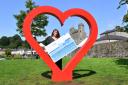 Noelle McAloon from Enniskillen BID at the heart shaped selfie frame in Broadmeadow.