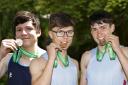 St.Michaels Athletics Jack O'Connor, 100m and Sean Corry 800m and Oliver Polak, Devenish College, with their gold medals in The Irish Schools Championships.