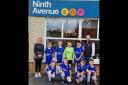 Jones Memorial PS football team pictured with David and Chloe from Ninth Avenue.