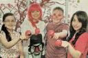 LEFT: Having fun during the Red Nose Day for Comic Relief at Jones Memorial Primary School are teacher Yvonne Sheerin and pupils (from left) Rebecca Dickson, Kyle Miller and Emma Irwin. 2013.