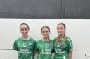 Captain Laoise O'Keefe flanked by Erin Tierney and Sinead Barrett.