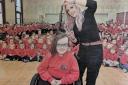 Lisbellaw Primary School Pupil Zahra Irvine (7) is pictured getting her hair cut by Julie Stubbs, Head Rush Lisbellaw for Muscular Dystrophy UK. Zahra, a Lisbellaw schoolgirl with a rare muscle-wasting condition that has left her wheelchair-bound, cut