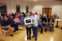 Karen Greene receiving her Overall Award from judge Des Clinton at the Enniskillen Photography Society awards night.