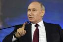 In this handout photo provided by Photo host Agency RIA Novosti, Russian President Vladimir Putin gestures while speaking at a plenary session of the St. Petersburg International Economic Forum in St. Petersburg, Russia, Friday, June 16, 2023. (Alexei