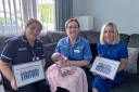 Lisnaskea mum of three Amanda Oldfield pictured presenting two special framed photographs to Brenda  Lead Midwife South West Acute Hospital and Omagh Hospital and Primary Care Complex and Staff Midwife Pauline Brogan who looked after Amanda and Jessica.