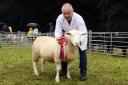 Rodney Balfour with his Champion Ile de France sheep at the Show.