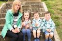 Aileen Swift with her children Clodagh, Sean and Cahir enjoying ice cream in the park.