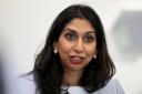 Home Secretary Suella Braverman speaks to volunteers during a visit to Bolton Lads and Girls Club in Bolton, Greater Manchester (Justin Tallis/PA)