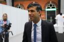 Prime Minister Rishi Sunak tours the Exhibitor’s Hall at the Manchester Central convention complex, during the Conservative Party annual conference (Carl Court/PA)