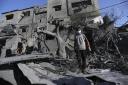 A Palestinian boy stands amid the destruction after an Israeli strike in Rafah, Gaza Strip, on Tuesday, October 31. Photo: AP.