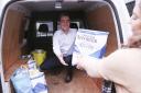 Rodney Edwards, Editor of The Impartial Reporter, helping to fill up the Foodbank Van.