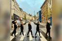 Cast of ELO's School of Rock The Musical recreating the famous Abbey Road Beatles cover.