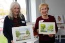 Mary-Anne Grant and Moyra Tapster display their watercolour prints.