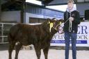 Daniel Woods, with his third-place heifer.