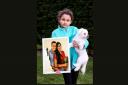 Valentina Fernandes holds a picture of her mum and dad.