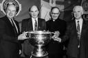 Frank McManus, 1993 (left), with Peter Quinn, GAA President; Fr. Michael McGourty and Val Cassidy, former Principal, St. Aidan's, Derrylin.