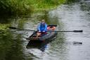 Liam Boyle from Knockninny rowing his handmade cot on the lough at Enniskillen