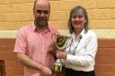 Winner Rodney Kelly receiving the cup from Aileen Cox