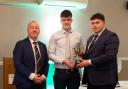 Allistair Crawford receiving the Vice-President's Prize at the Harper Ireland Club dinner from outgoing Chairman, Anthony Donnelly. Looking on is Basil Bayne, Student Co-ordinator.