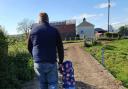 Richard Dane with his daughter on their farm in Lisbellaw.