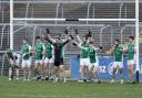 Most of the Fermanagh squad block the goal line as free-in is taken near the goals.