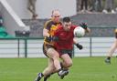 Shane Rooney lays a tackle on Daniel McElvanney