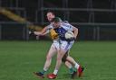 Jason Love collides with Eoin Maguire