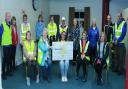 Members of Fivemiletown Walking Group presented a cheque for £500 to Marie Curie.